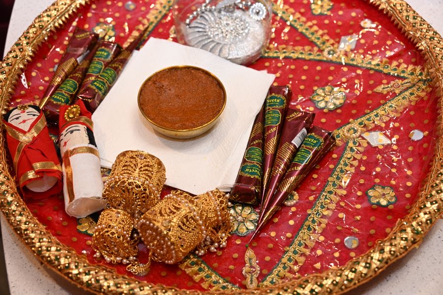 A decorated pooja thali with kumkum and ritual items